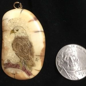 Scrimshaw pendant one and half inch with small gold toned bale